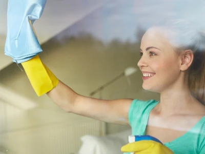 Woman washing a window